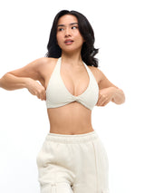 Thumbnail 1 of Twisted Halter Sports Bra - Bone, 1 of 6